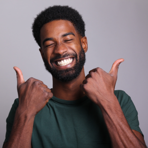 Happy TT3 Repairs customer giving a thumbs up after a successful device repair